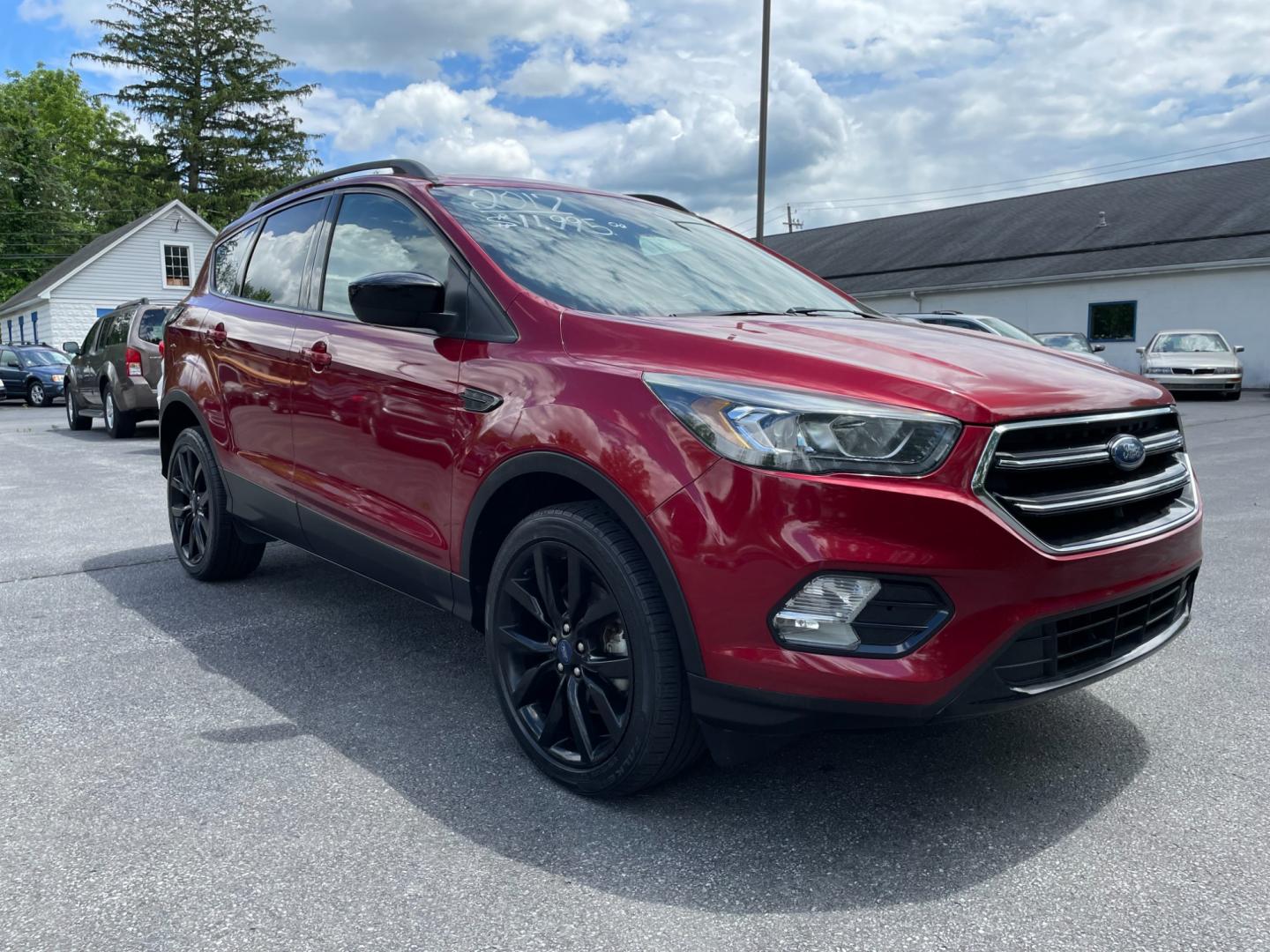 2017 Red Ford Escape SE 4WD (1FMCU9GDXHU) with an 1.5L L4 DOHC 16V engine, 6A transmission, located at 101 N. Main Street, Muncy, PA, 17756, (570) 546-5462, 41.207691, -76.785942 - Photo#1